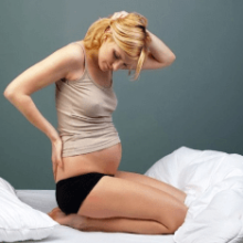 Причины боли в копчике при беременности